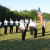 The Honor Guard fires a salute.